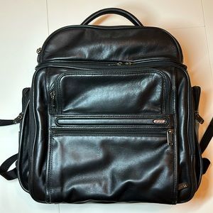 Tumi leather laptop backpack. Perfect for executives on the go.